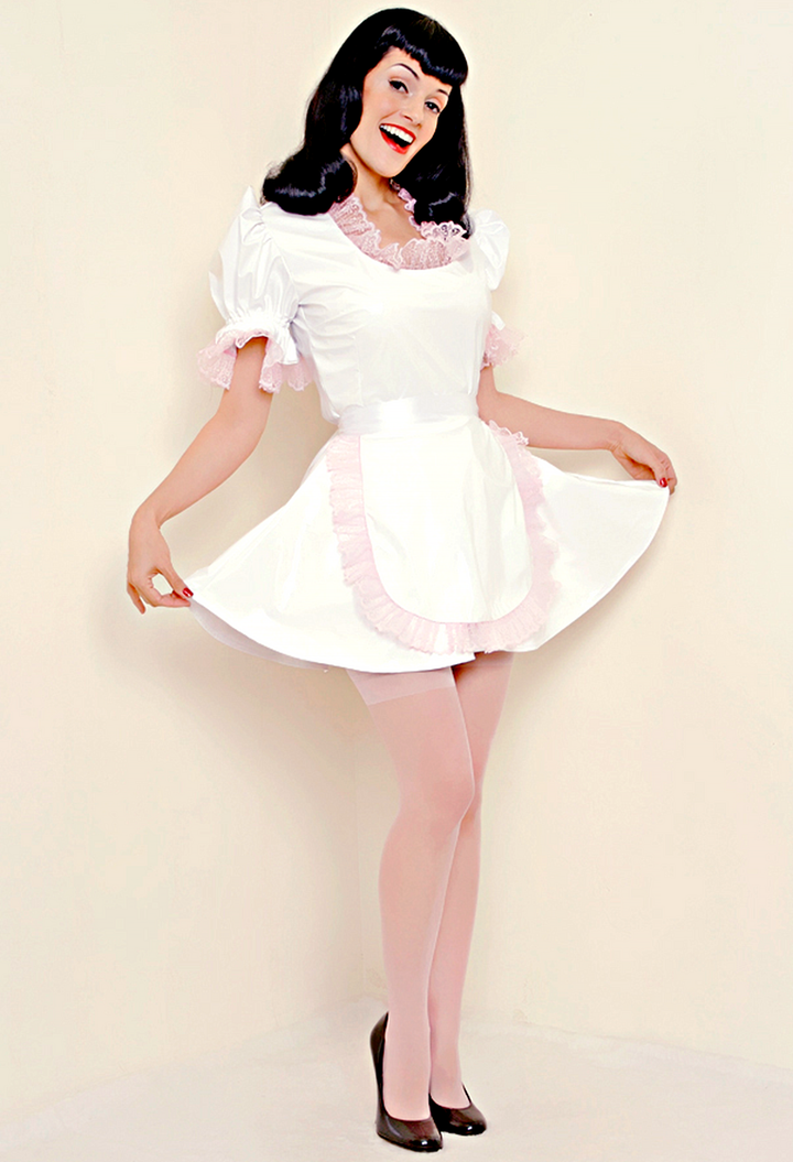 Bernie Dexter in original Versatile Fashions Fitted French Maid Dress in white PVC w/ pink lace trim